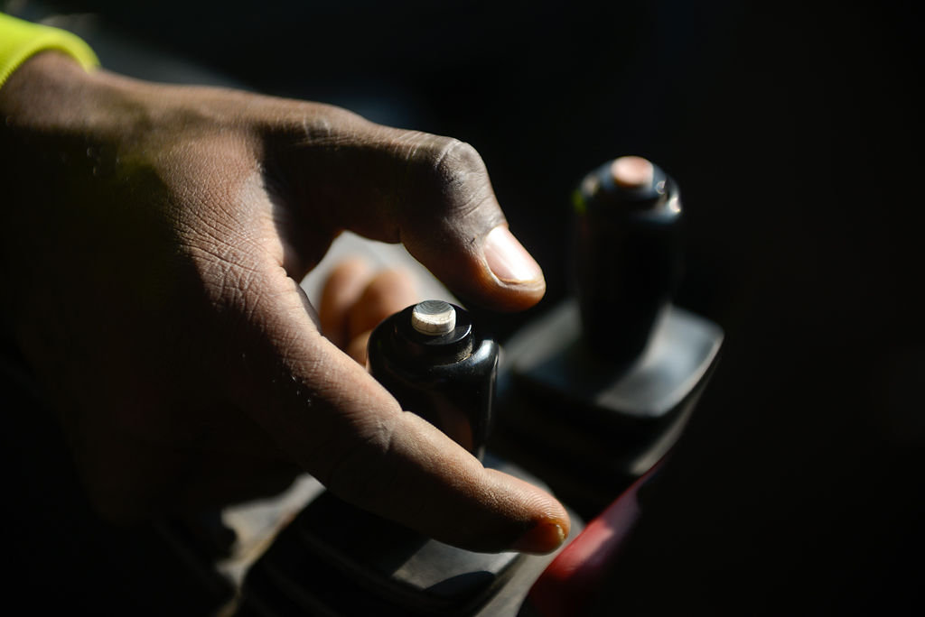 Marquell Robinson controls the direction of his vehicle's plow by using a remote
